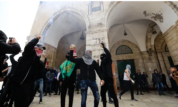 Palestinians in the al-Aqsa compound on Sunday. Photograph: Anadolu Agency/Getty Images